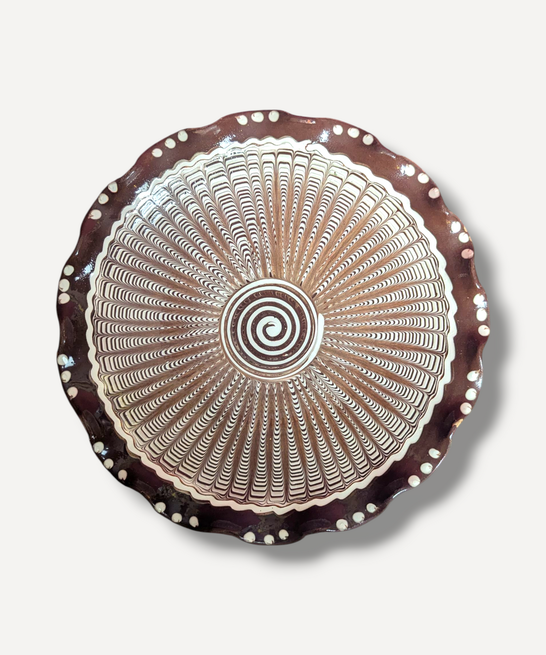 Decorative plate with concentric circle pattern on a white background