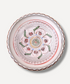 Decorative plate with intricate patterns on a white background