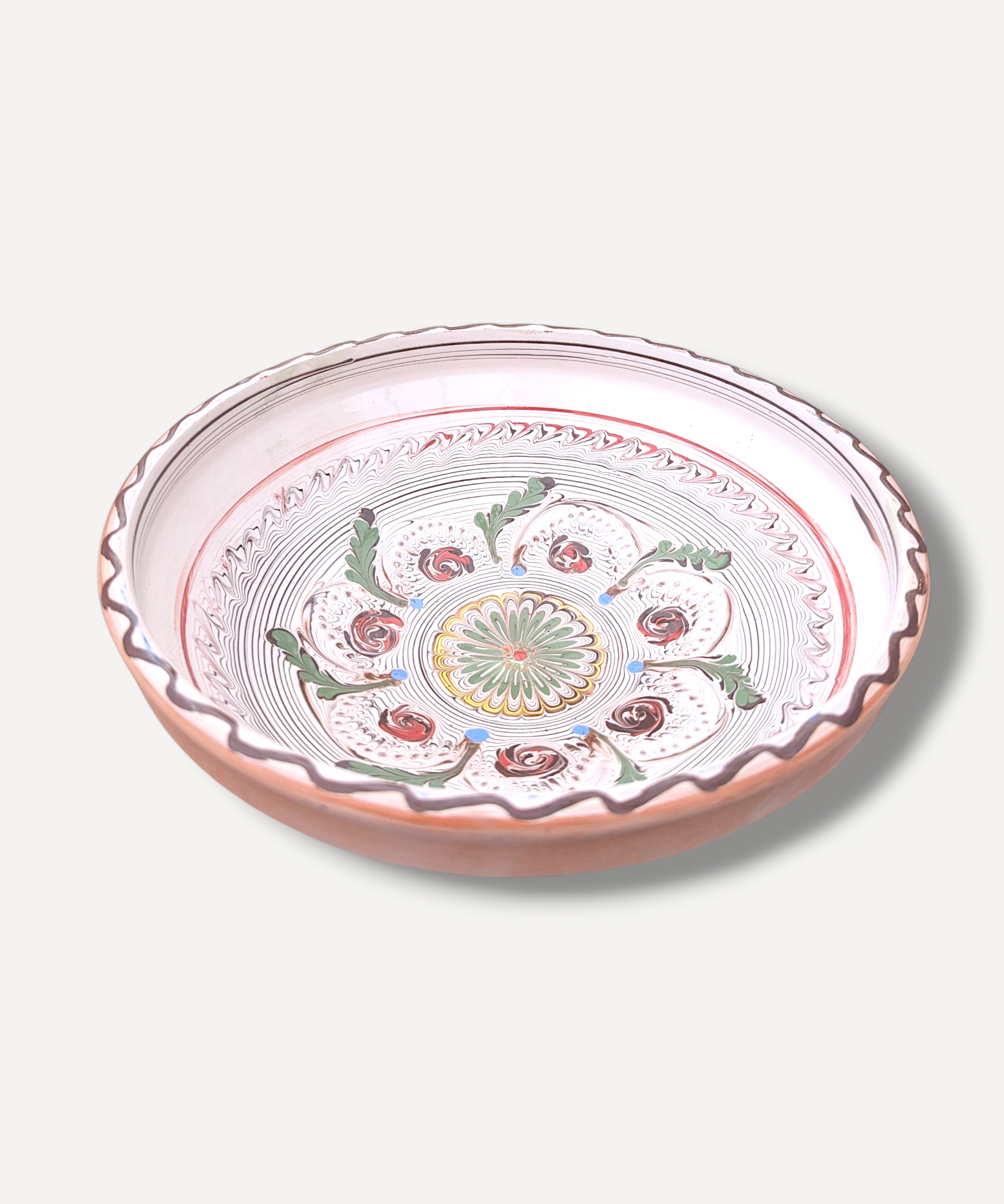 Decorative ceramic plate with floral patterns on a white background