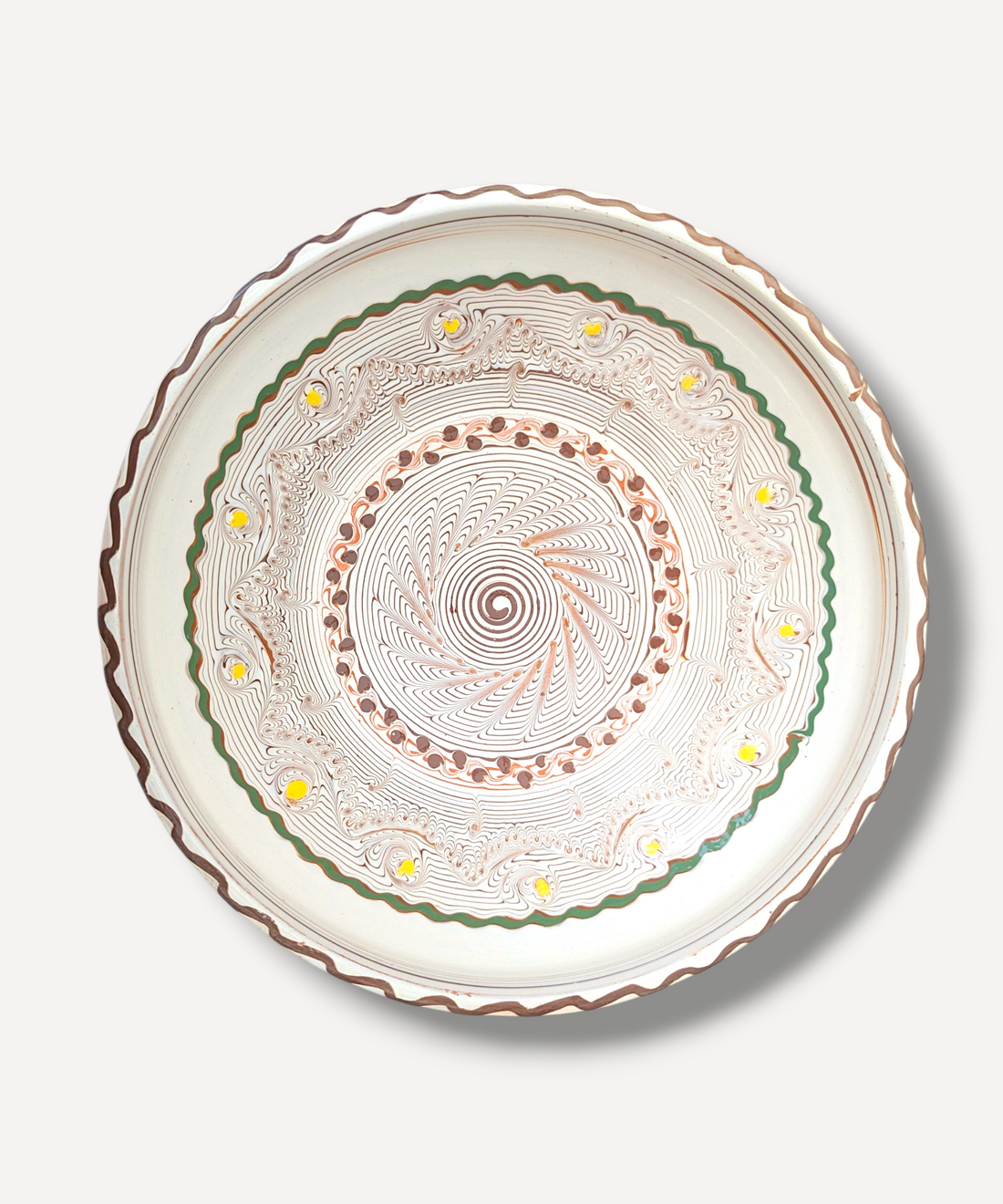 Handcrafted Romanian bowl with intricate patterns on a light background