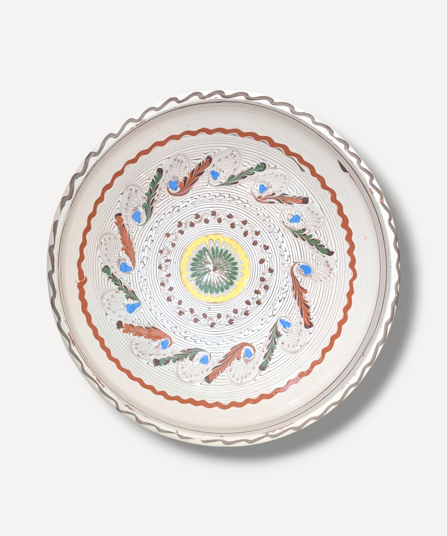 Decorative bowl with intricate patterns on a light gray background