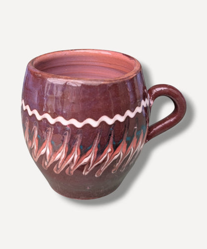 Dark chocolate brown handmade ceramic mug with traditional Romanian folk decoration