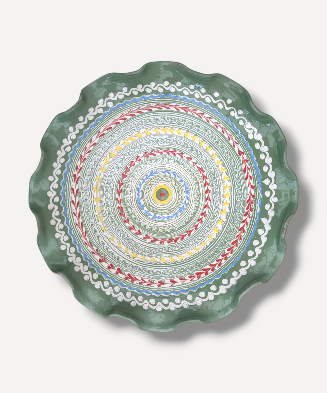 Decorative plate with colorful circular pattern on a white background