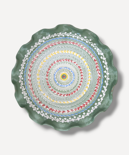 Decorative plate with colorful circular pattern on a white background