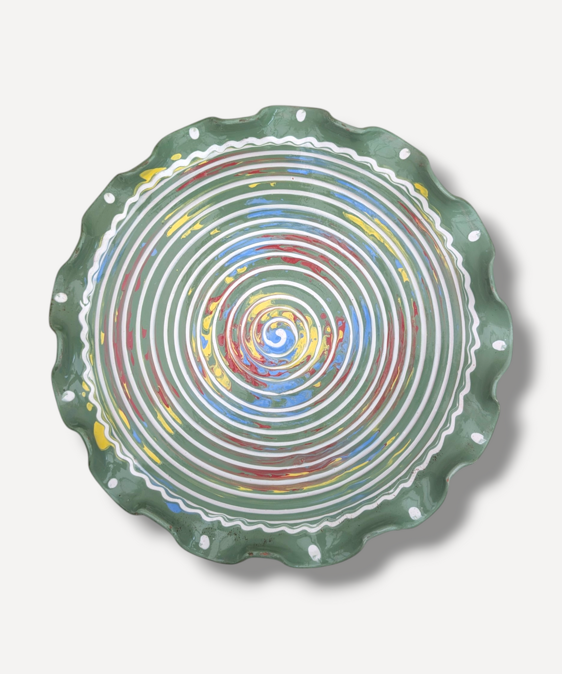 Decorative plate with concentric circle pattern on a white background