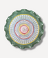 Decorative plate with a colorful spiral design on a green rim against a white background