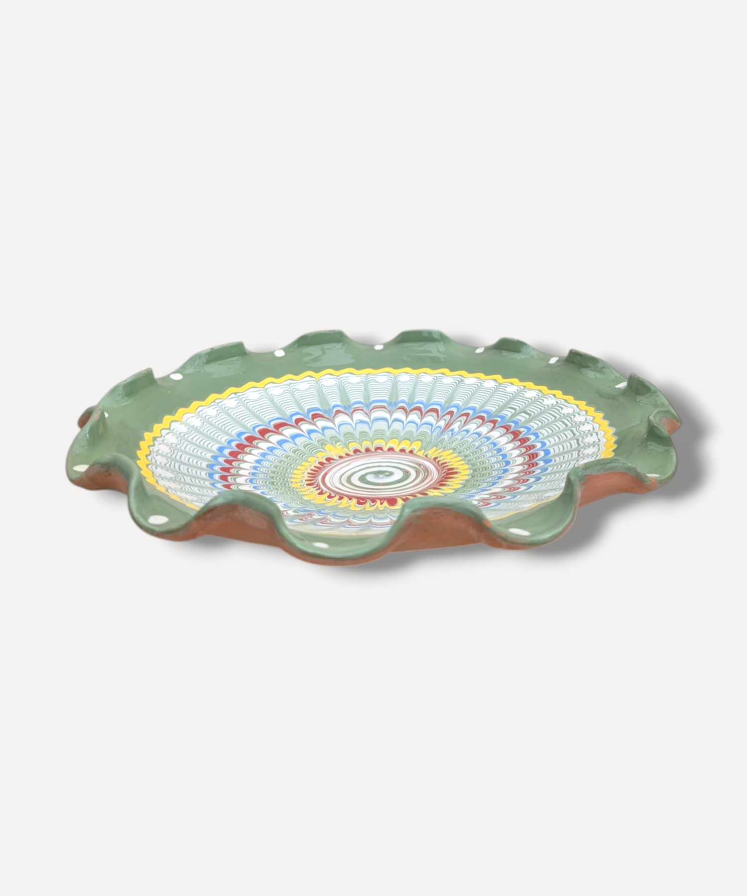 Decorative ceramic plate with colorful concentric circle design on a white background