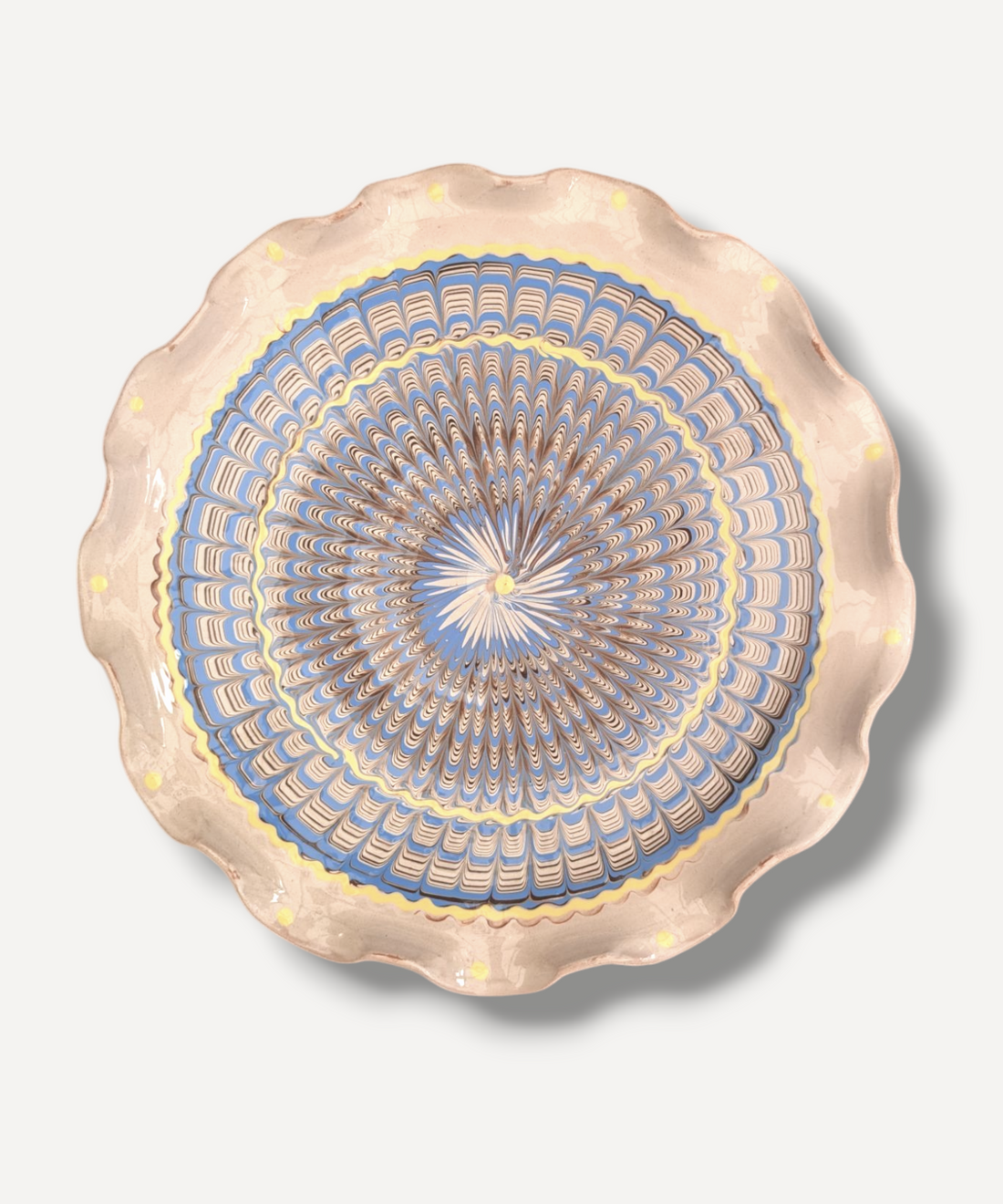 A large, 25cm glass serving plate with a ripple effect design with soft blue and yellow pop detail.