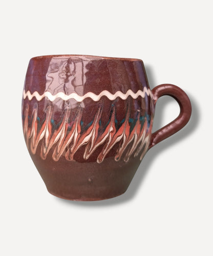 Dark chocolate brown handmade ceramic mug with traditional Romanian folk decoration