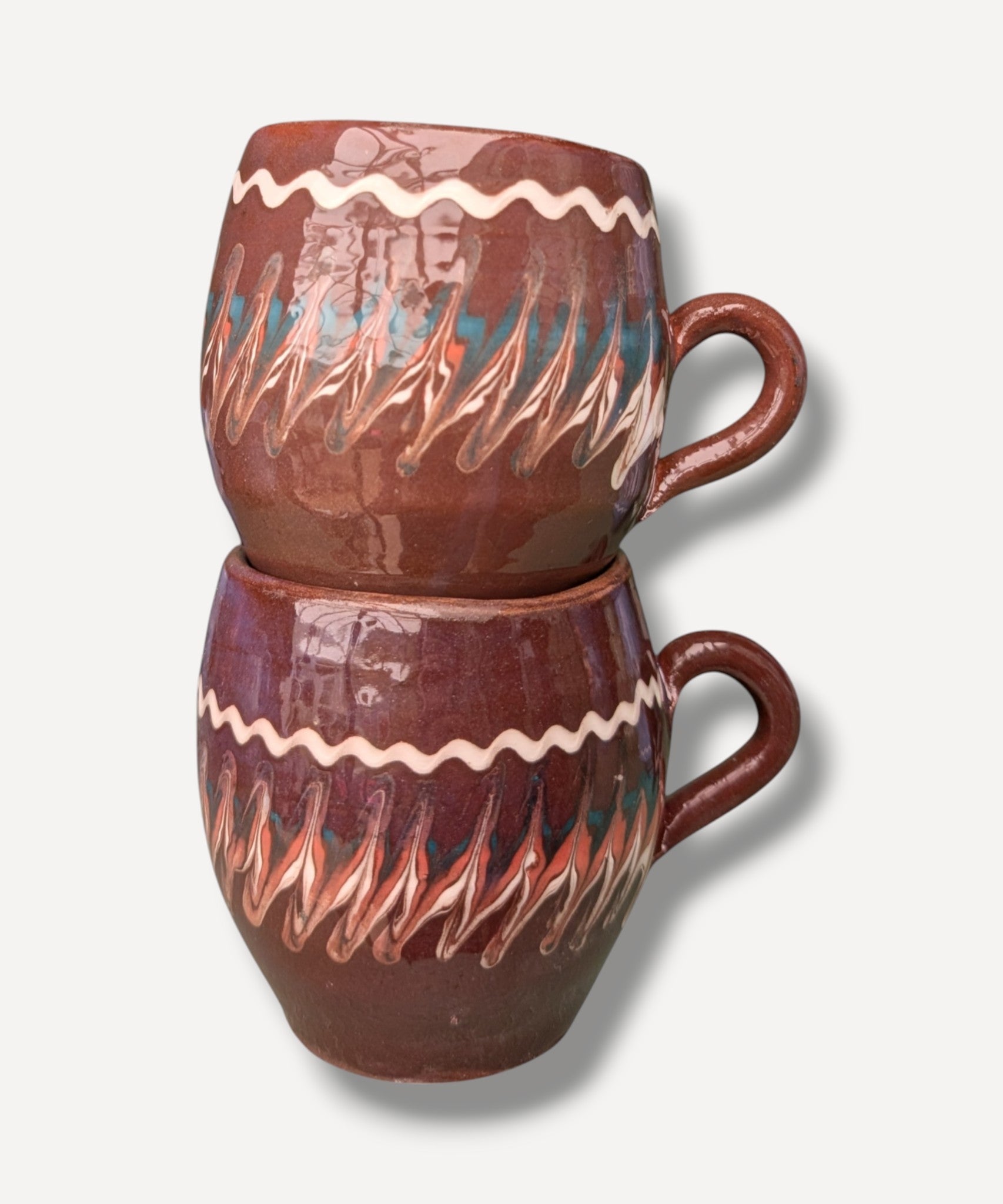 Dark chocolate brown handmade ceramic mug with traditional Romanian folk decoration