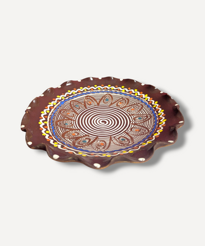 Decorative plate with spiral pattern on a white background