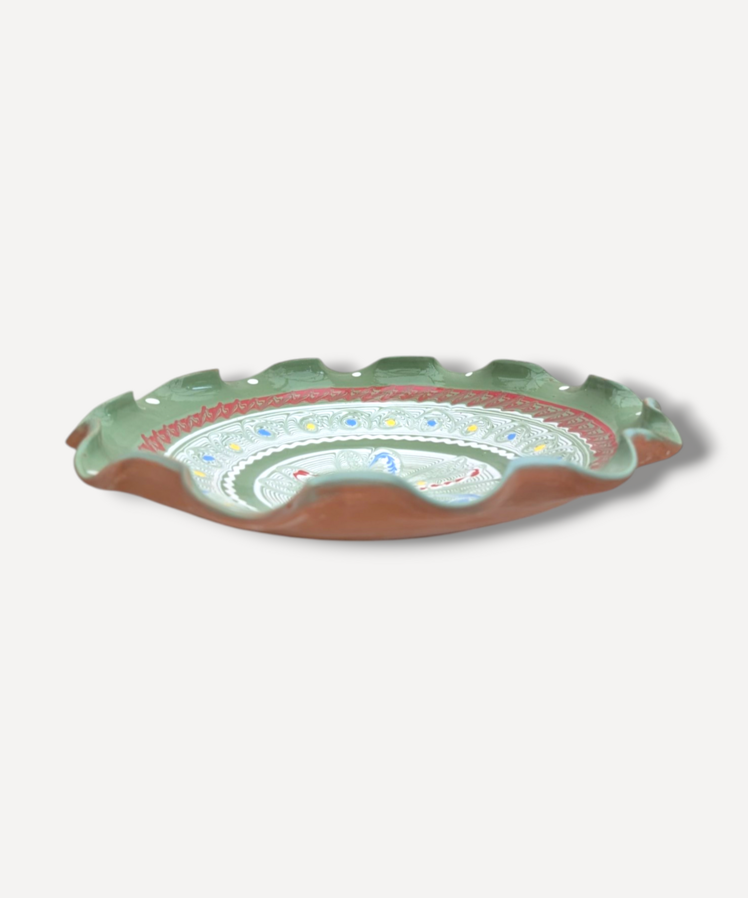 Decorative ceramic plate with floral patterns on a white background