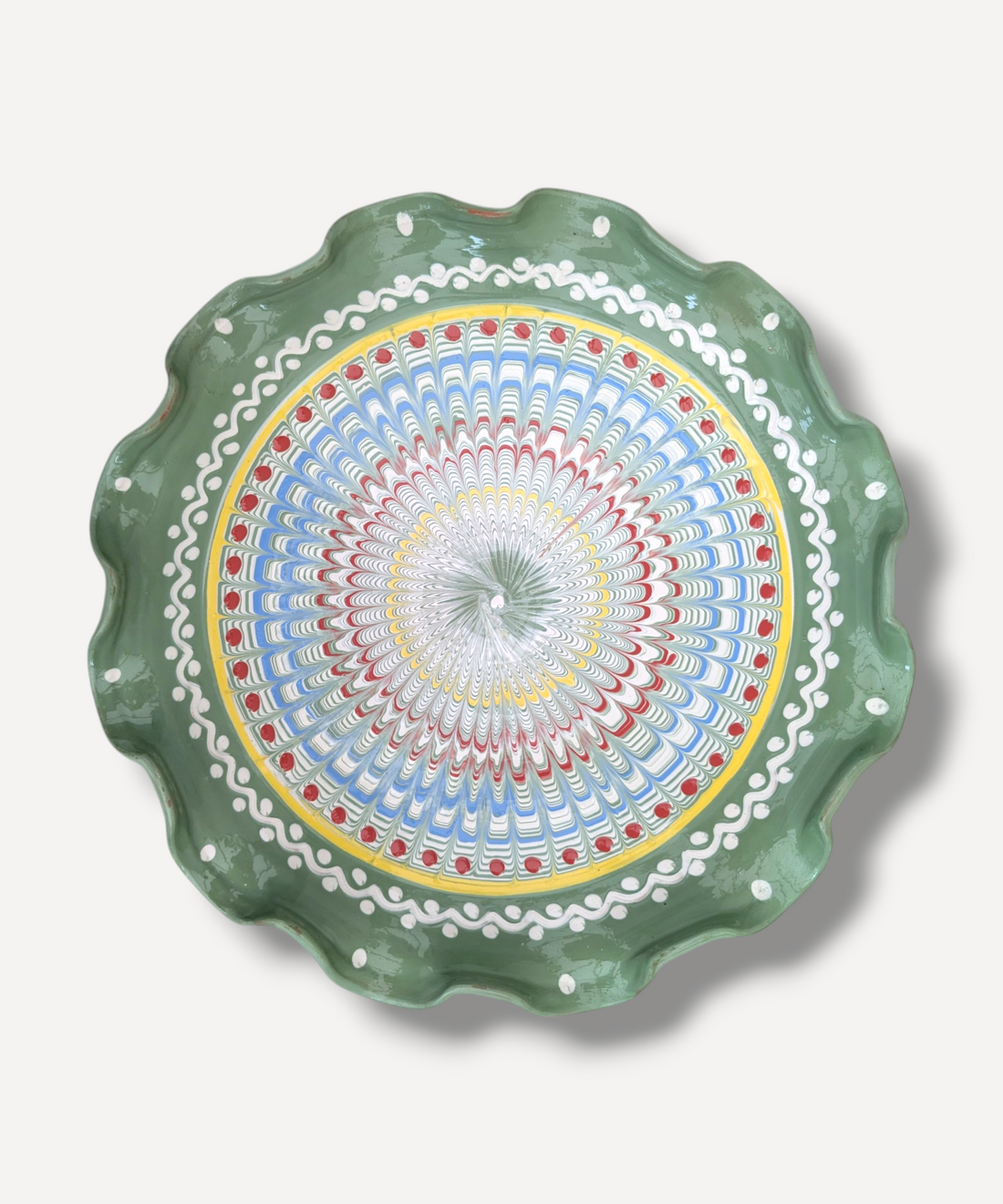 Decorative plate with a colorful circular pattern on a white background