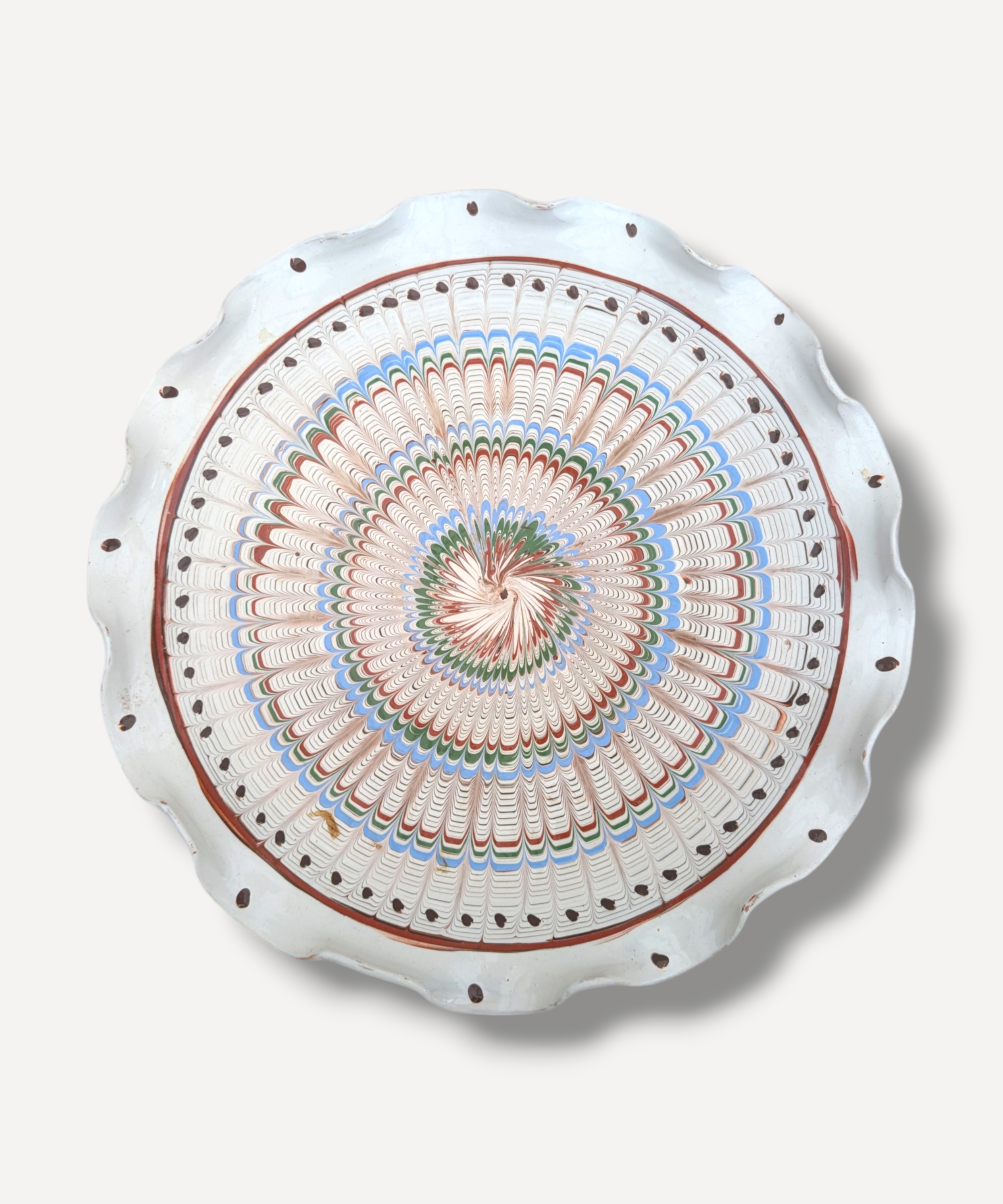 Romanian earthenware serving platter with radial folk decoration in terracotta blue and green