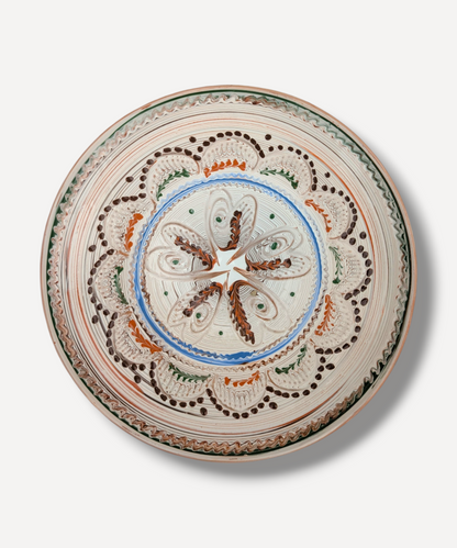 Hand decorated Romanian ceramic platter with floral star folk motif and terracotta border
