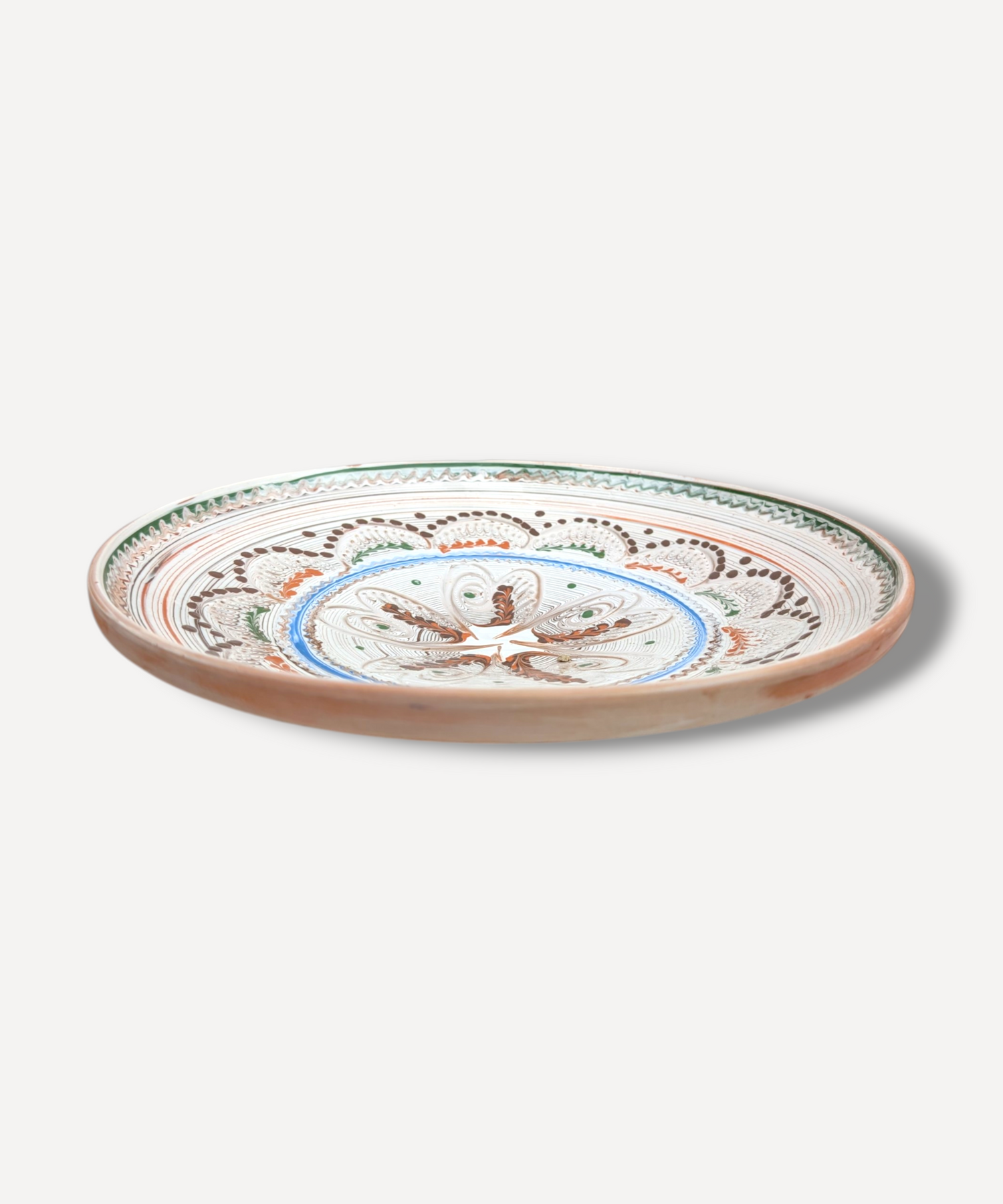 Hand decorated Romanian ceramic platter with floral star folk motif and terracotta border