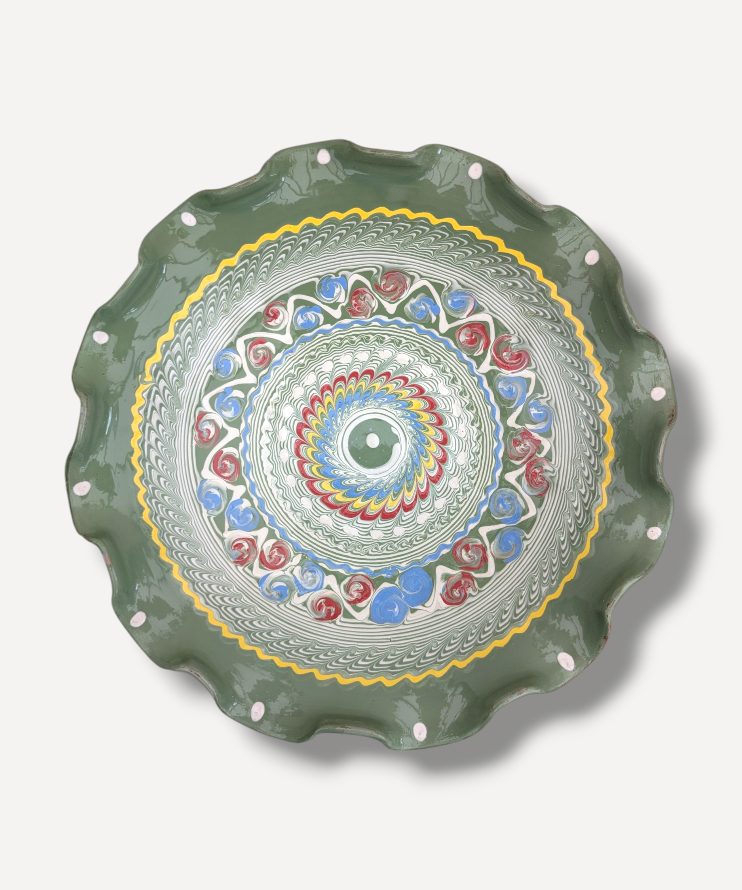 Decorative plate with a colorful spiral pattern on a white background