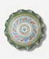 Decorative plate with a colorful spiral pattern on a white background