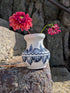 Handmade white Romanian earthenware vase with black floral motifs, a rounded body and a sculptural narrow waist. By Casa De Folklore 