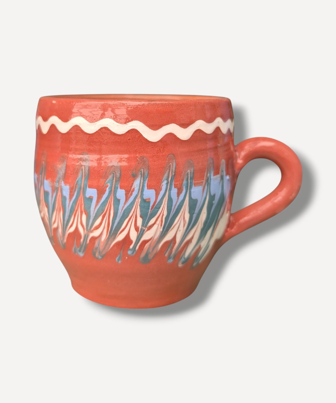 Terracotta handmade ceramic mug with blue and ivory Romanian folk decoration