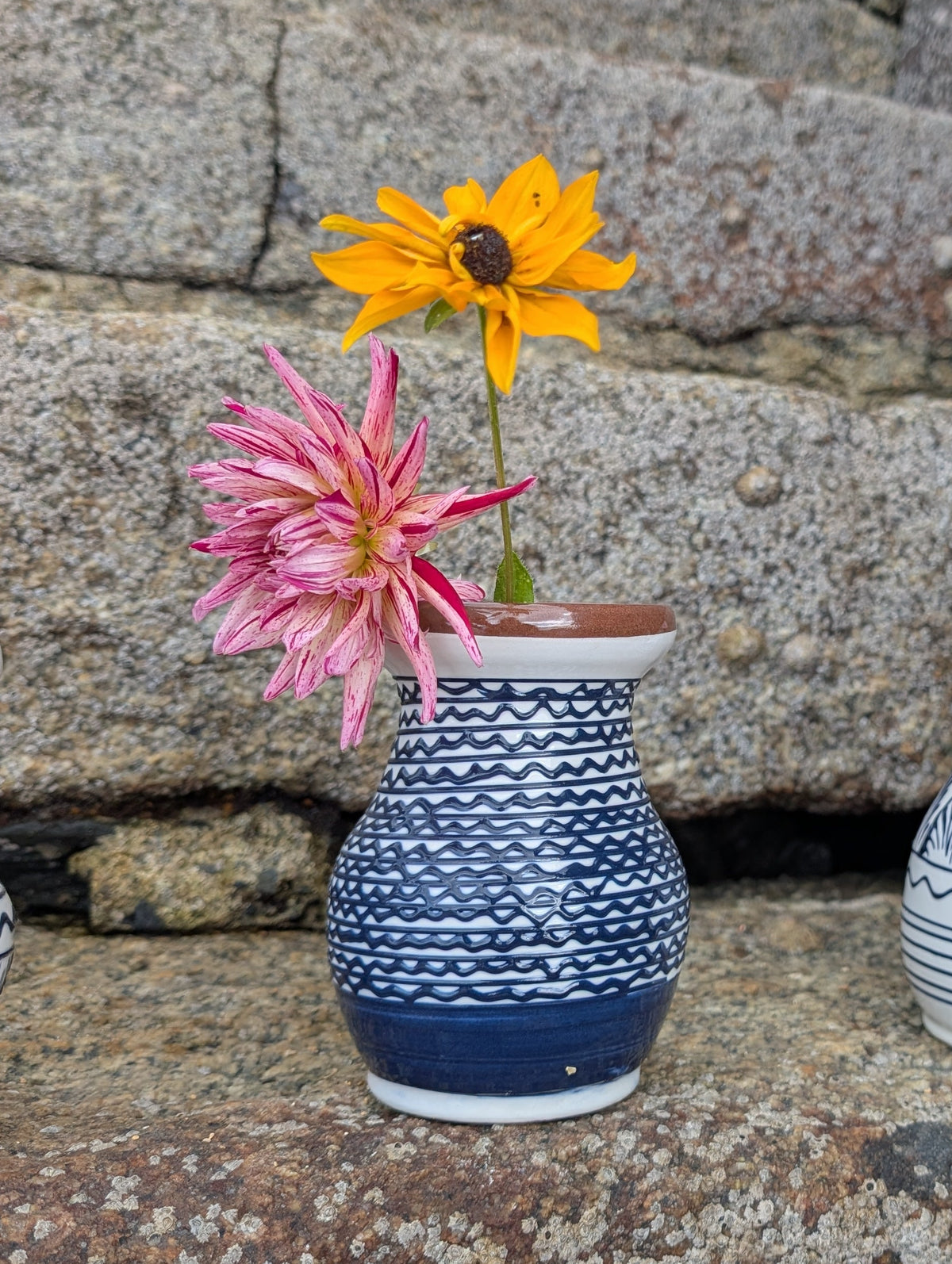 Handmade white Romanian earthenware vase with cobalt-blue geometric waves.