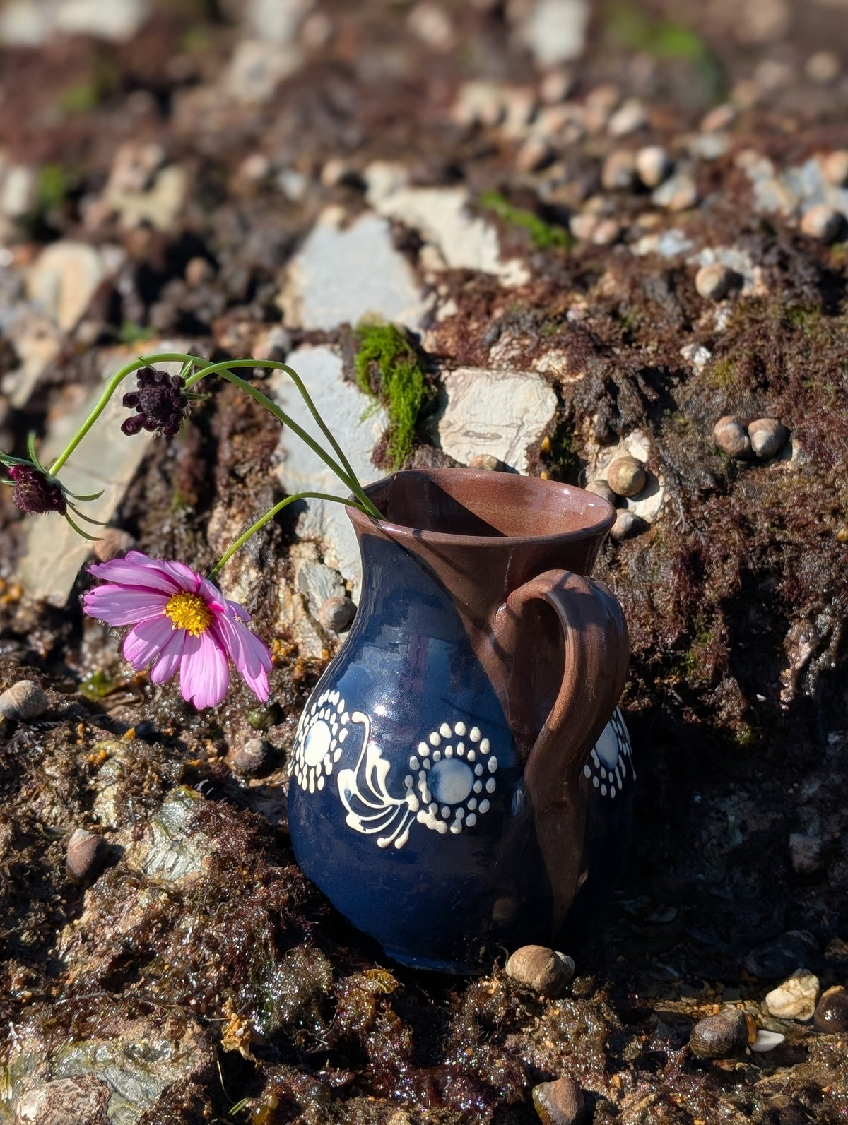Handmade white Romanian earthenware vase with cobalt-blue geometric waves, scalloped bands and botanical decoration.