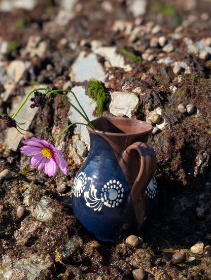 Handmade white Romanian earthenware vase with cobalt-blue geometric waves, scalloped bands and botanical decoration.