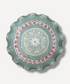Decorative plate with intricate patterns on a light gray background