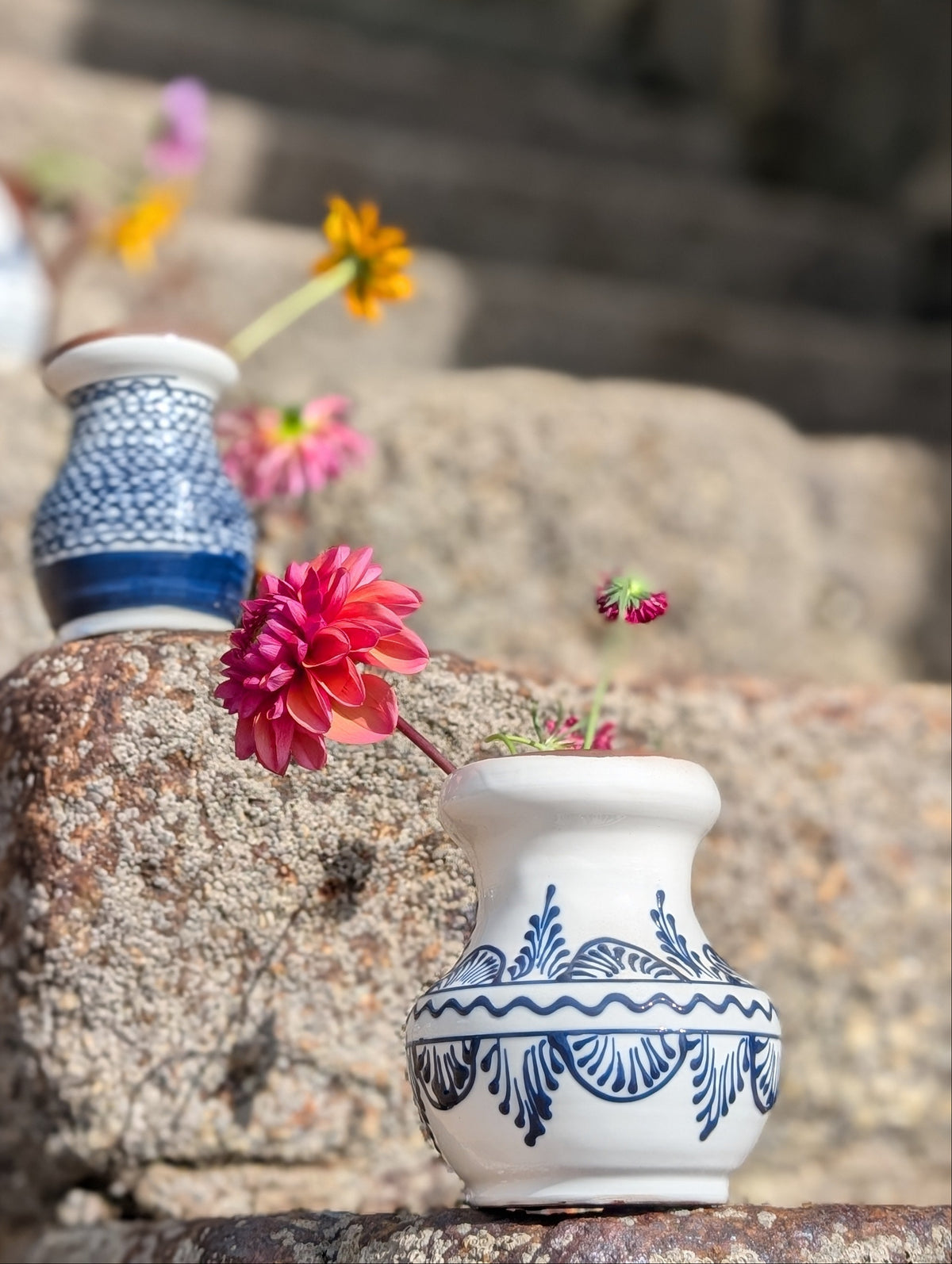 Handmade white Romanian earthenware vase with black floral motifs, a rounded body and a sculptural narrow waist. By Casa De Folklore 