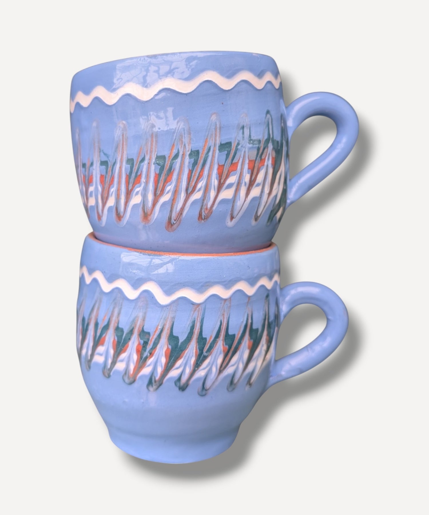 Handmade blue ceramic mug with terracotta interior and Romanian folk pottery decoration