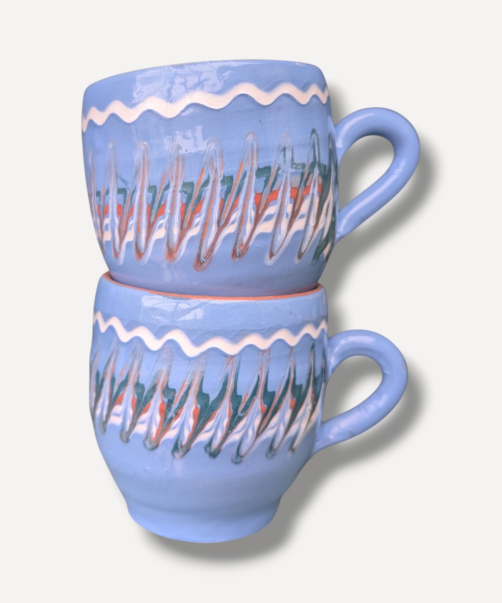 Handmade blue ceramic mug with terracotta interior and Romanian folk pottery decoration