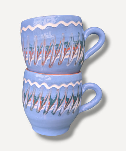 Handmade blue ceramic mug with terracotta interior and Romanian folk pottery decoration