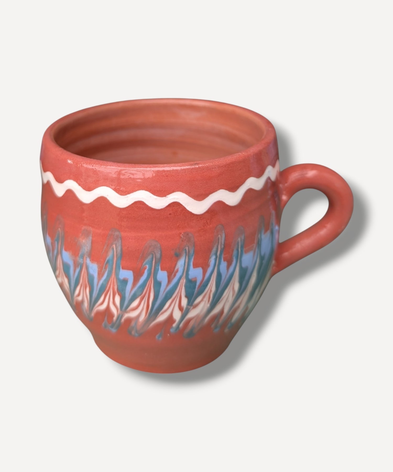Terracotta handmade ceramic mug with blue and ivory Romanian folk decoration